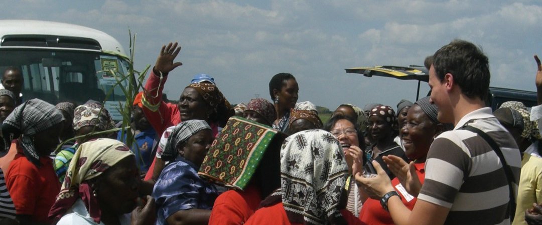 Community members celebrating with visitors during a 2011 field visit in Mozambique
